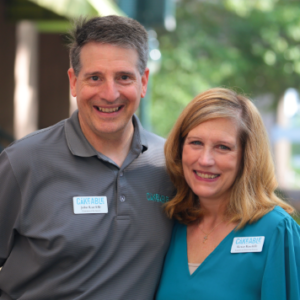 John and Renee Ratcliffe standing together wearing Cakeable name badges